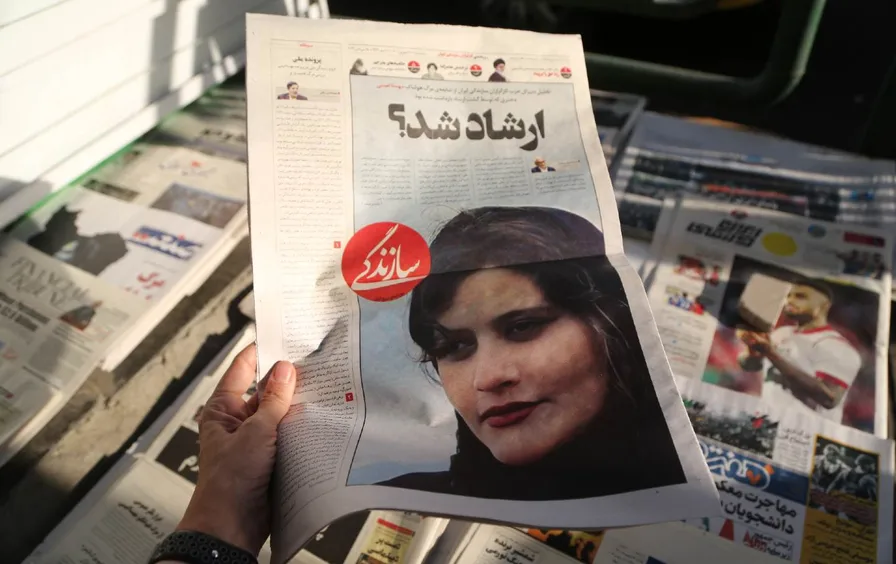 The front page of an Iranian newspaper featuring a Kurdish protester who died in police custody. (Fatemeh Bahrami / Anadolu Agency via Getty Images)