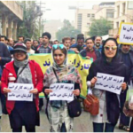 Demonstration in support of protesting steel workers by their families in the city of Ahvaz, Iran, in December 2018. The placards read: “We are the children of workers. We stand alongside them.” © Iranian Labour News Agency